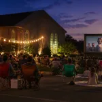 Church lawn movie night with The King of Kings on an inflatable screen